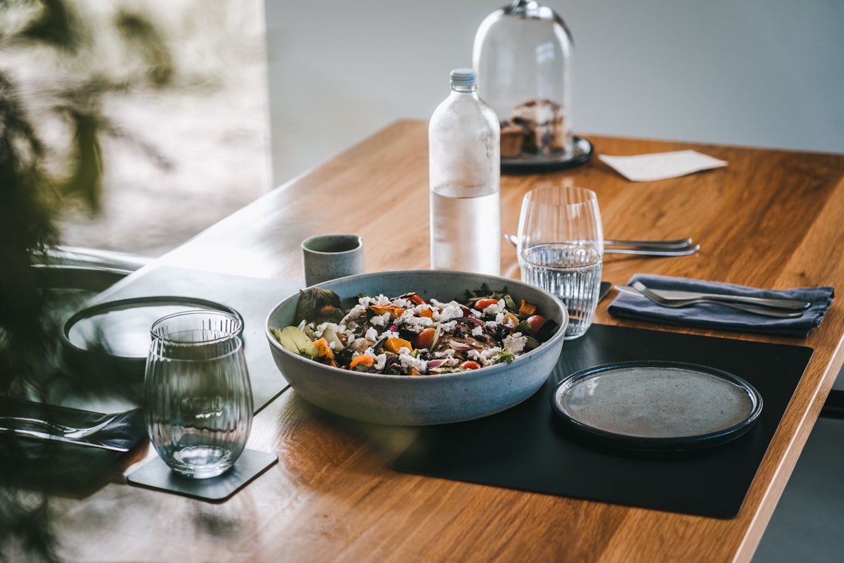 Nutritionist consultation workspace with healthy food and planning materials